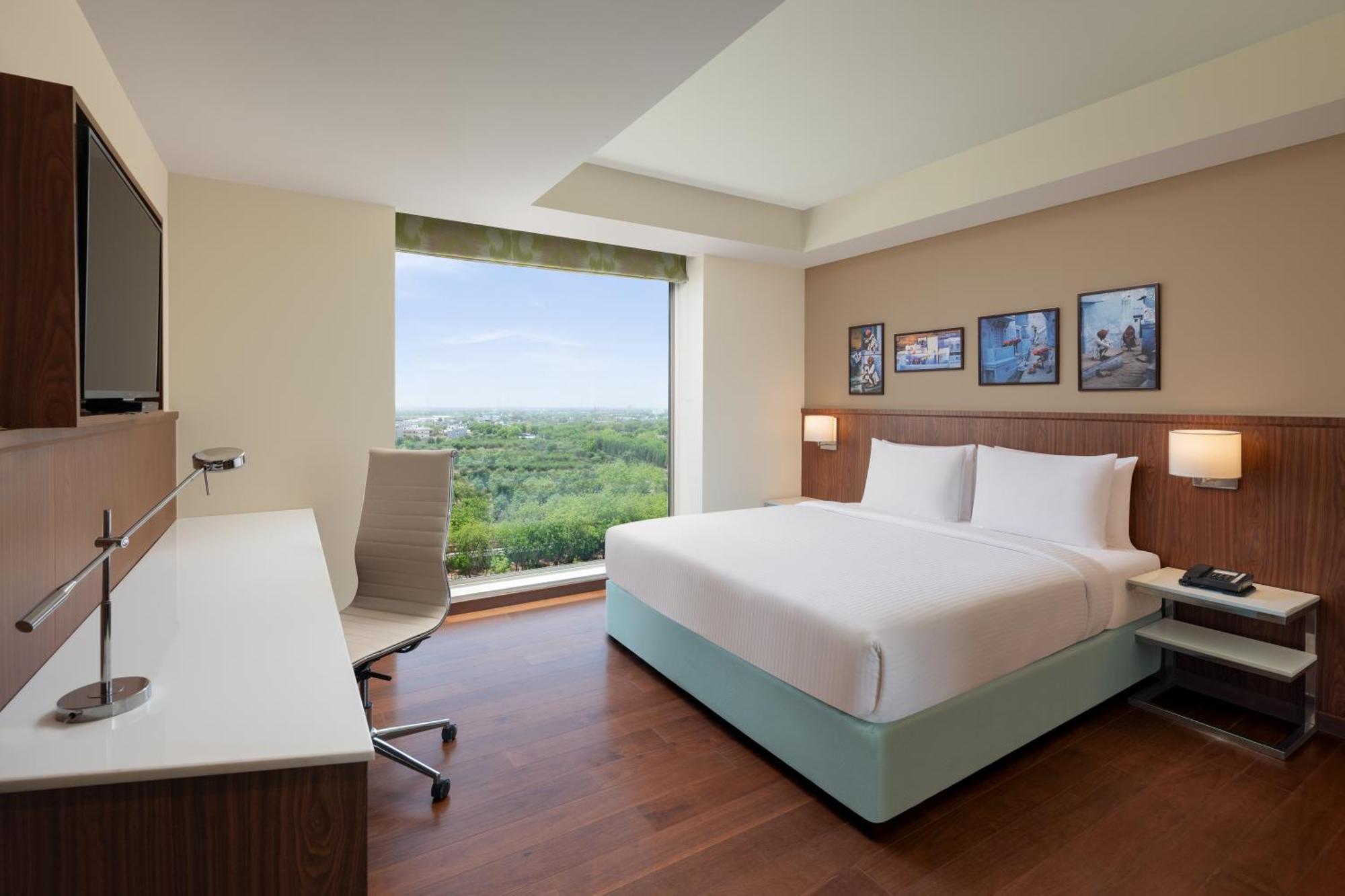 Fairfield One-Bedroom King Suite with City View: (15% Discount on food & soft beverage at Kava Restaurant, Happy Hours (Buy 1 Get 1) on IMFL beverages at the BAR)